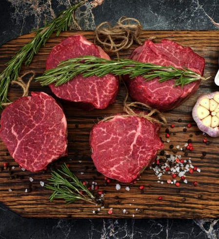 steaks on a cutting board